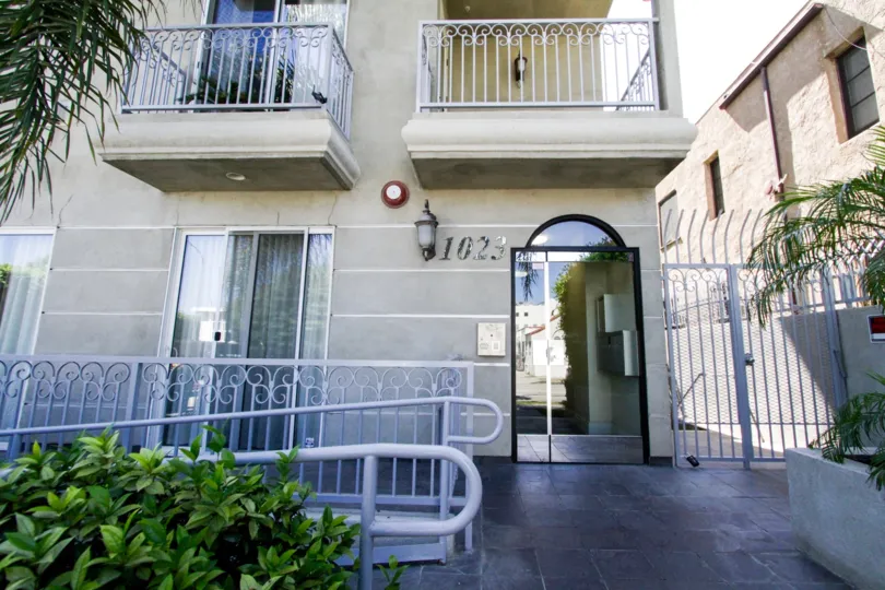 A Glass door leads the front entrance of Hollywood Gate Homes