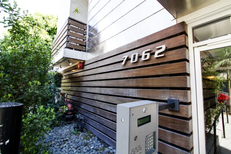 Wood slates with the address numbers greet residents of Hollywood Lofts