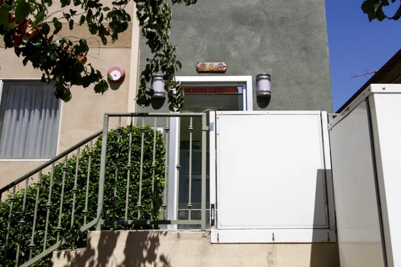 The glass front door to Hudson Villas