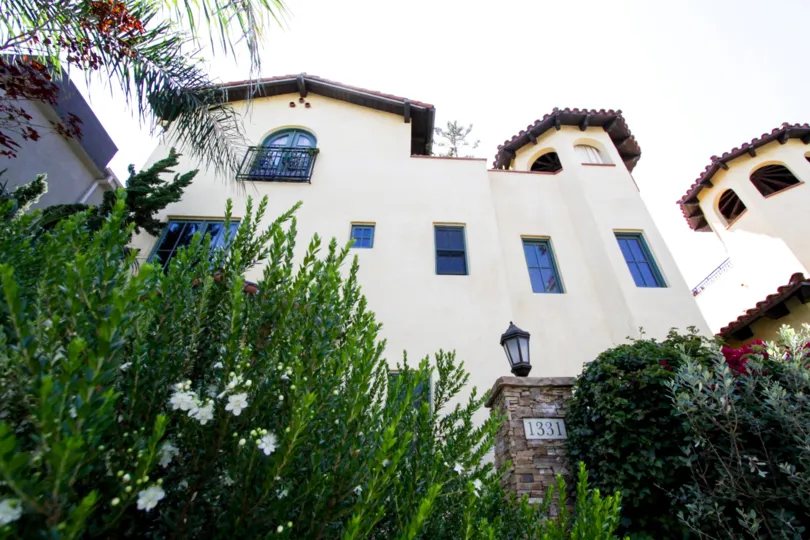La Serenata is lushly landscaped with bushes and flowers throughout
