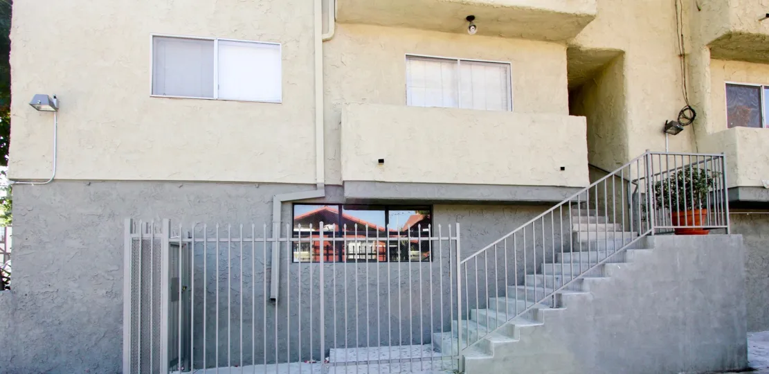 The gray and yellow color of the building at Orange Drive