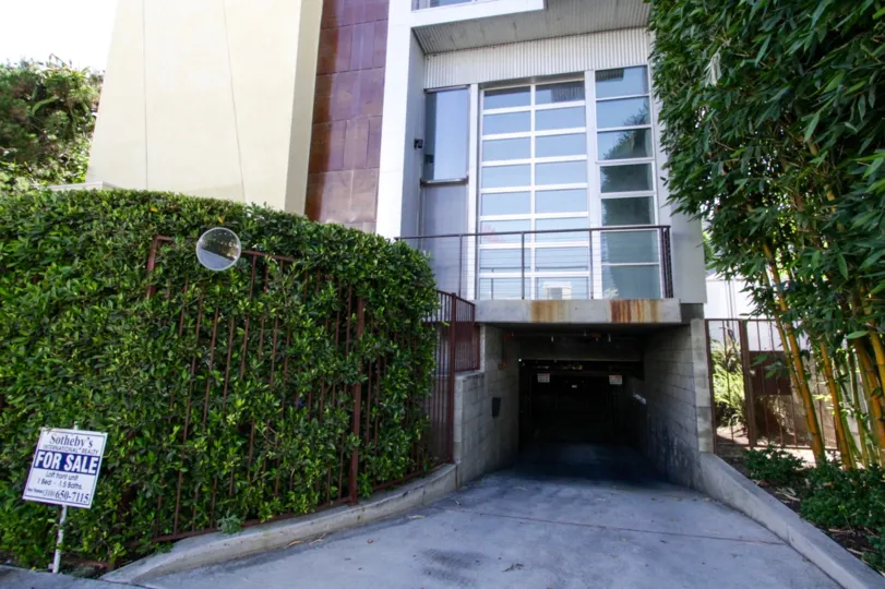 Underground gated parking entrance to Sunset Blvd Lofts at Bronson