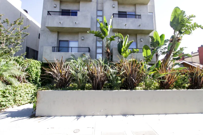 Concrete balconies with black metal railing at The Mark