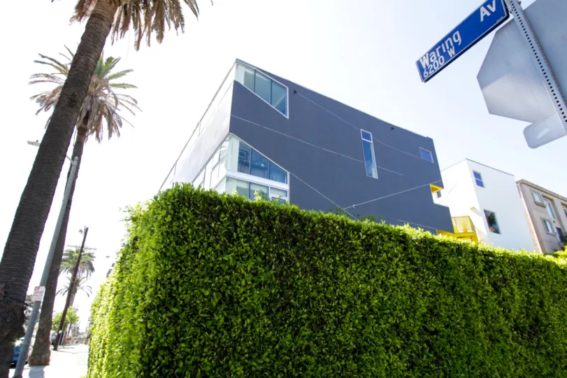 A large hedge surrounds the WA Lofts property