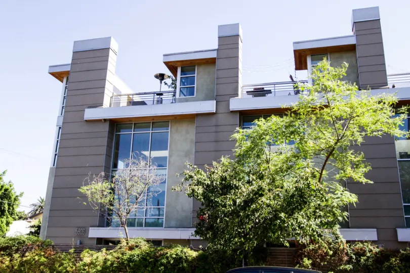 The perimeter of Waring Lofts is well landscaped with shrubs and trees