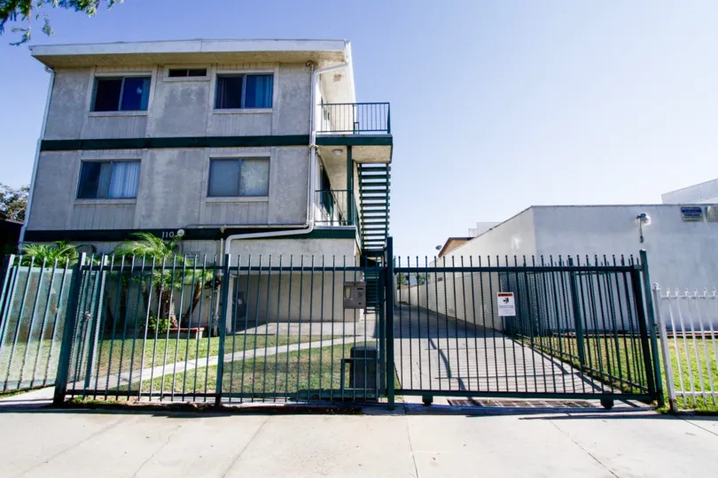 The gate and fence around Spruce Townhomes