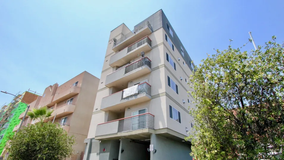 The residencies at 815 harvard shows long balconies on one side of the building.