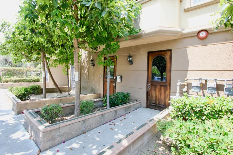 A sunny day in the Arena Cove Villas with an entrance of a house.