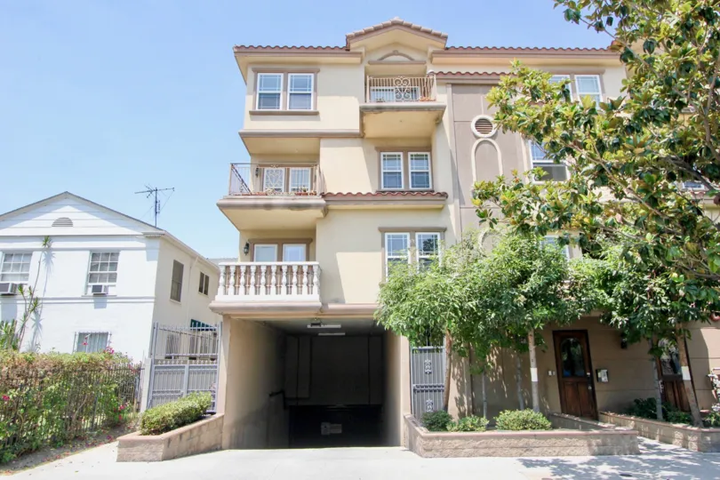 View of Arena Cove Villas on a clear day in Koreatown, CA