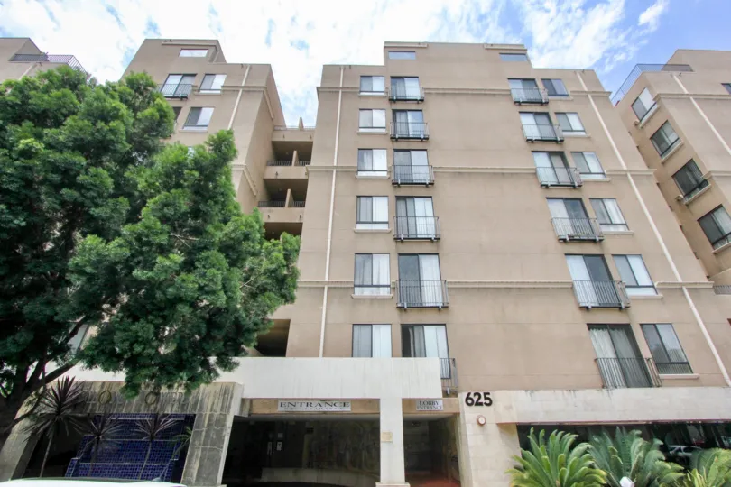 A big apartment complex that is surrounded by tress. The windows look small and the rooms do not seem to be very spacious.