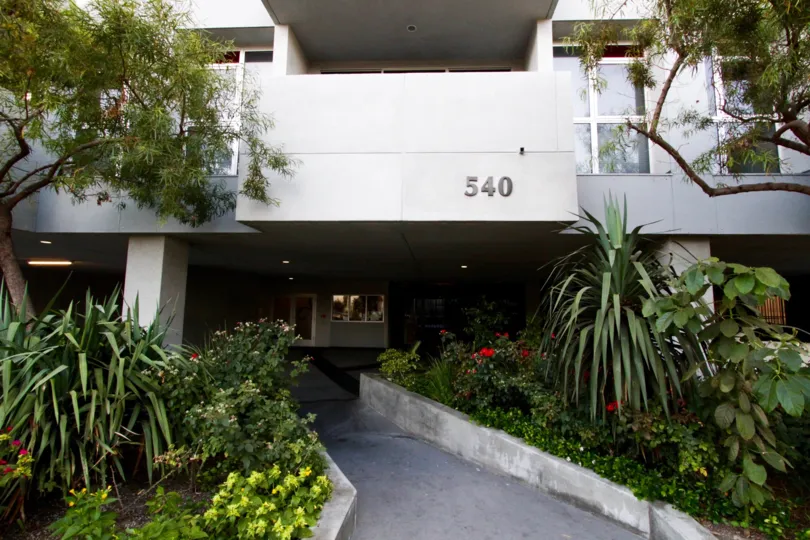 The entrance to Kenmore Tower is lined by raised concrete planters on both sides