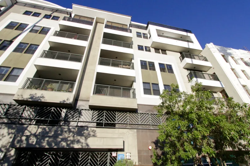The view of Kingsley Villa shows multiple balconies and iron work accents across the balconies