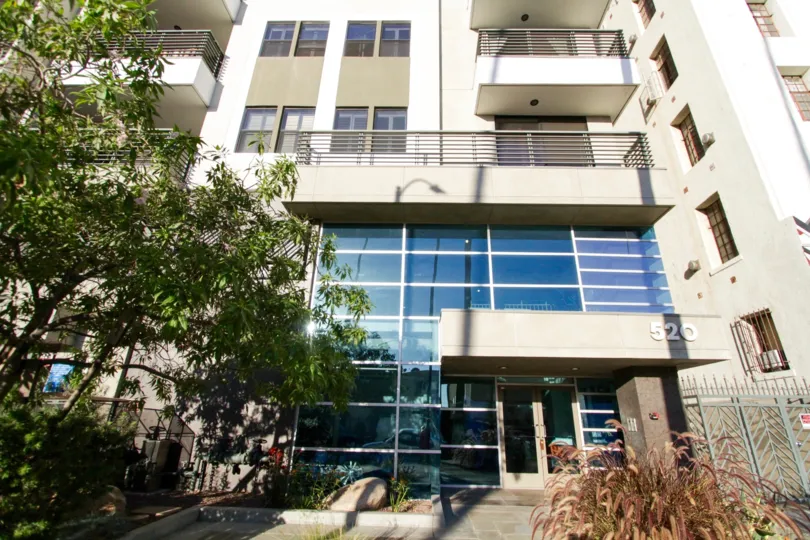 The pedestrian entry to Kingsley Villa has double doors and a two story lobby
