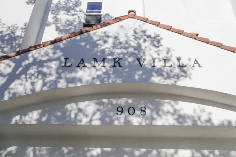 Black letters above the entry to Lamk Villa bare the building name