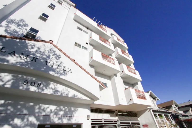 Balconies extend over the front of the Lamk Villa building