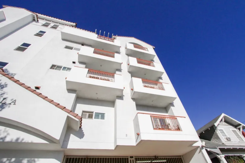 The side of the Lamk Villa building shows balconies at each floor