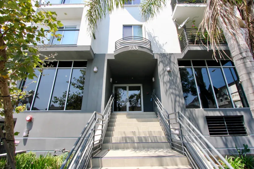 The white and gray stairwell that serves as an entry for the Manhattan View townhouses in koreatown California.