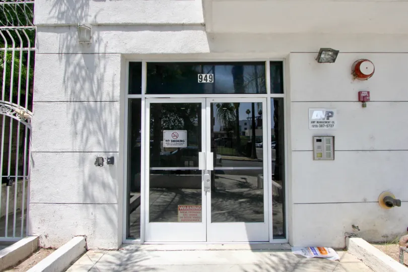 Entrance at Manhattan Village with glass doors and call box.