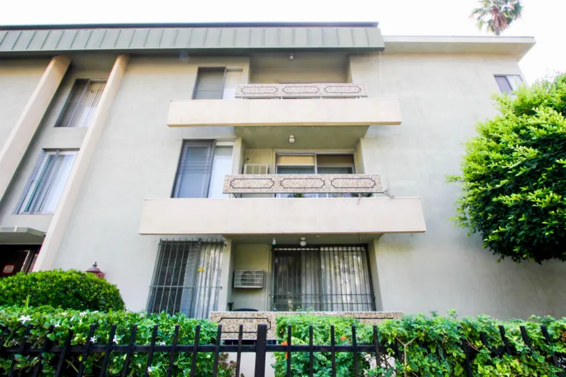 Front left view of a three-story apartment building in the Montclair Kenmore complex, Koreatown, California.