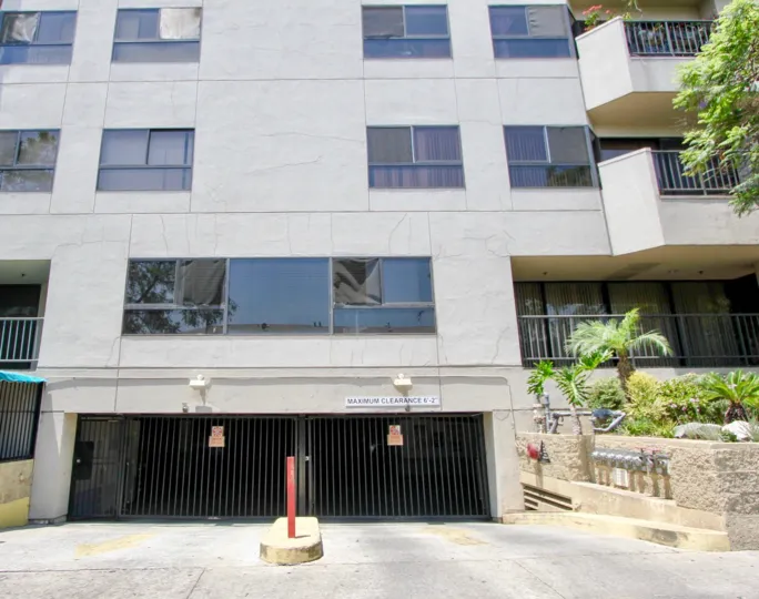 Parking entrance gate and a couple stories of Richmore Garden Towers