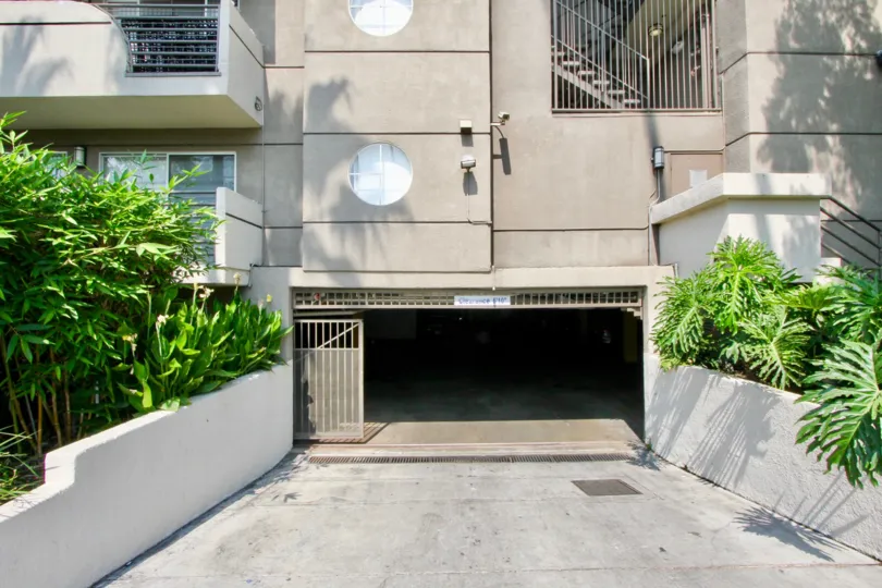 The Cleo front side with open gate and plants around