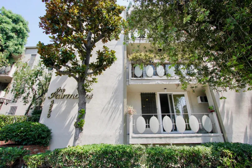 The beautiful tree is standing in front of the house in The Fairmount in koreatown.