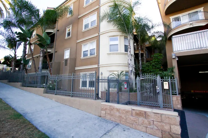 Beyond the gated entry of The Kensington is a lushly landscaped courtyard