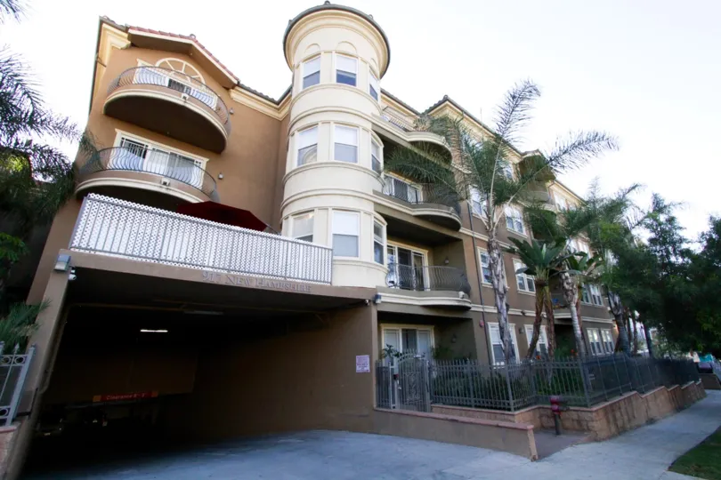The corner units of The Kensington offer oversized round balconies with ballooning railings