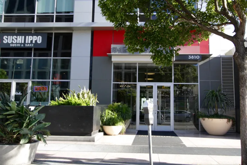 Bright red and dark grey contrast the entry area of The Mercury