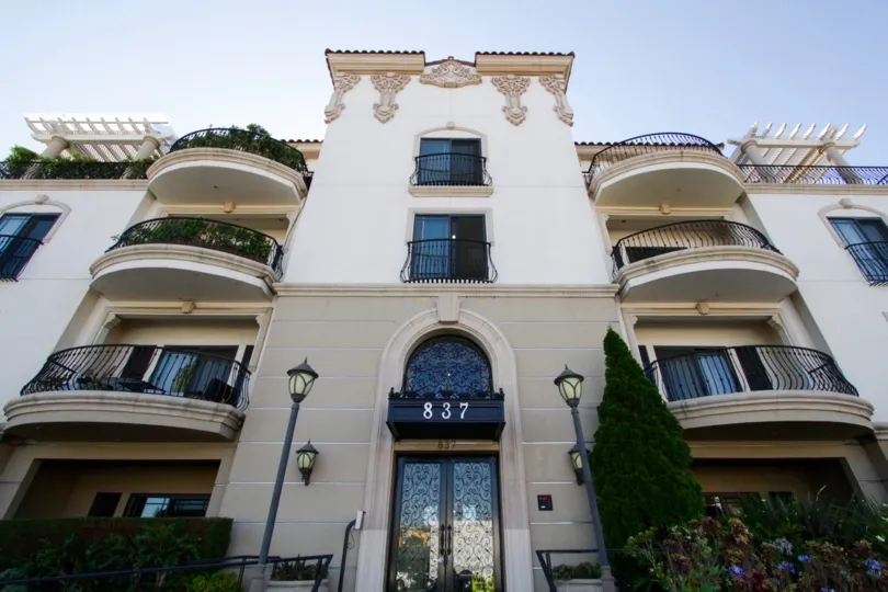 Balconies extend off the front of Wilshire Park Villa rounded with iron railings