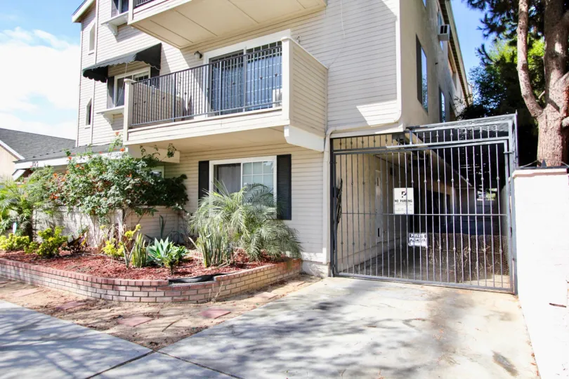 The parking area for residents of 1123 Junipero Ave