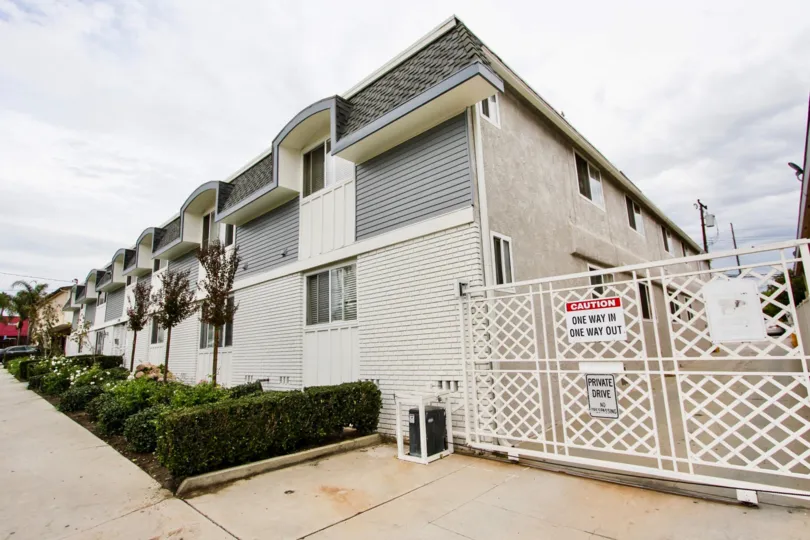 The parking entrance for residents at 1720 Newport Ave