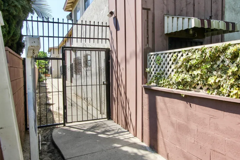 The gate for entrance to the side of 2020 W 23rd St