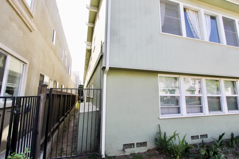 The gate between buildings at 3630 E 2nd St