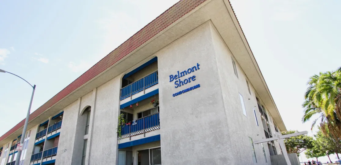 The name of Belmont Shore Condominiums on the building