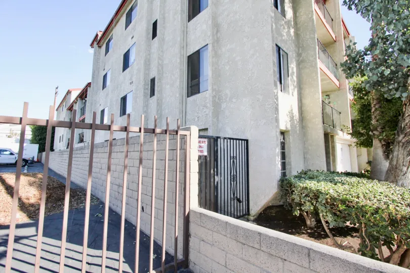 The gate into Bixby Elm Condominiums