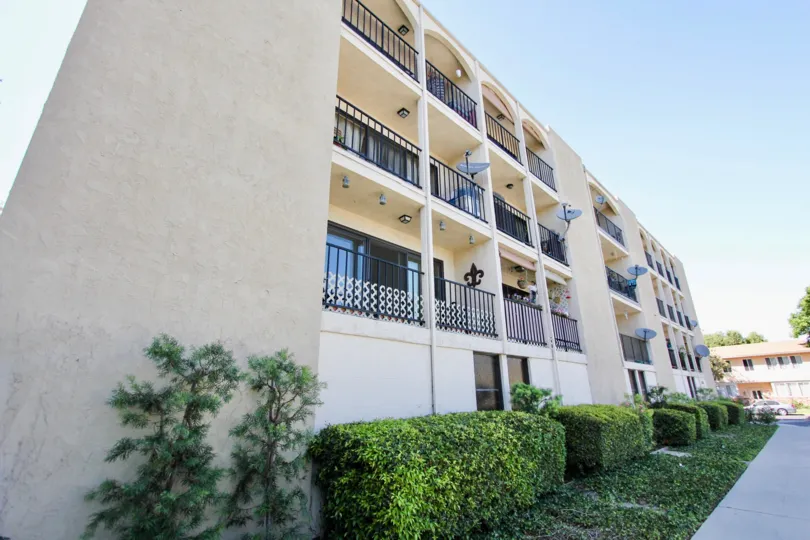 The hedges around the Bixby Villas building