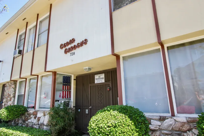 The Cedar Gardens name above the entrance
