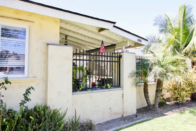The iron fence around Clark Avenue Villas in Long Beach, California
