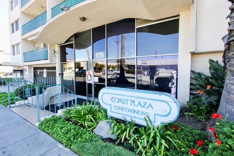 The greenery around the Coast Plaza sign in Long Beach, California