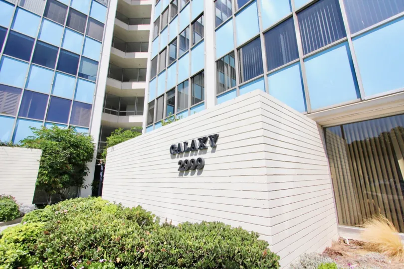 The name of the Galaxy Tower in front of the building