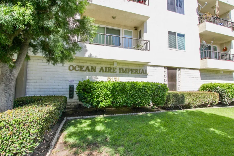 The name of the Ocean Aire Imperial on the building