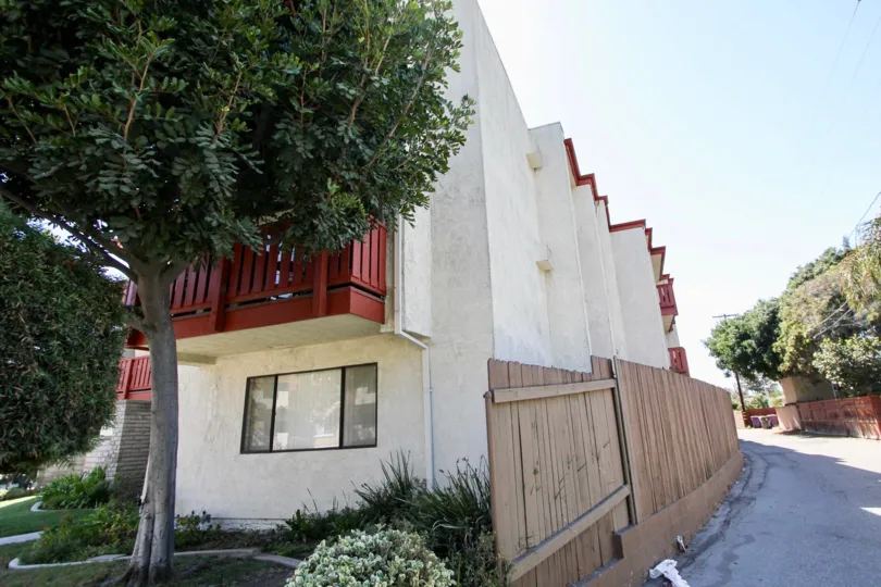 The privacy fence alongside Orange Villas