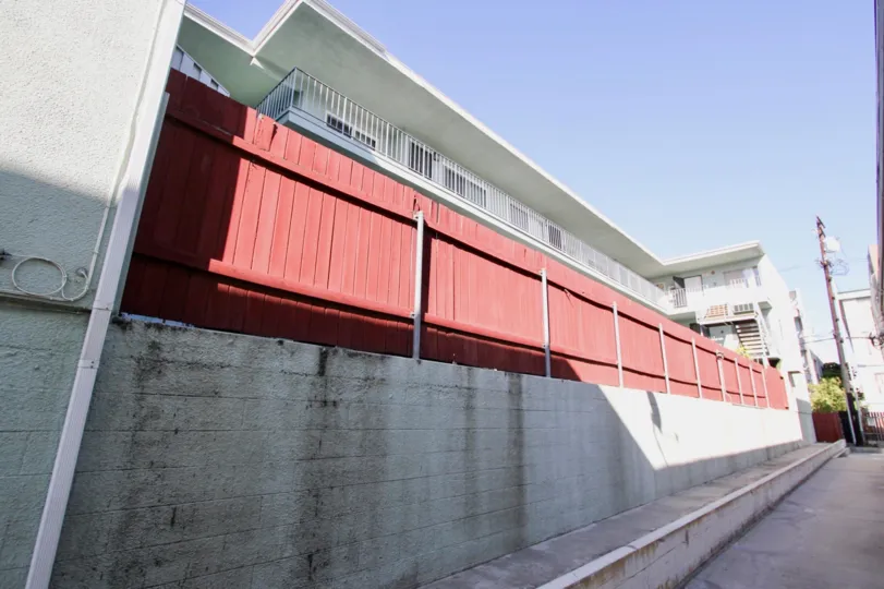 The red fence around Royal Elm for privacy