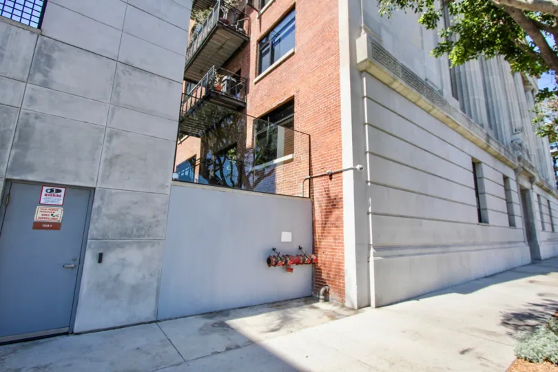 The sidewalk in front of Temple Lofts