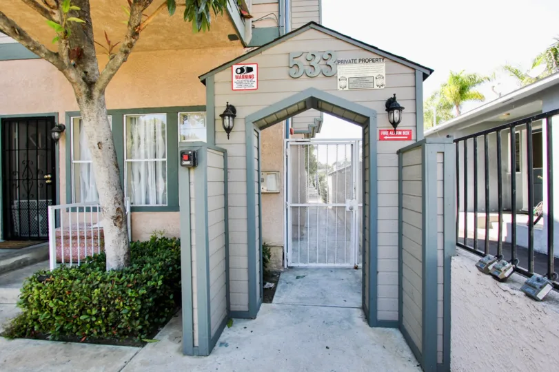 The address above the entrance into Walnut Ave Villas located in Long Beach, California
