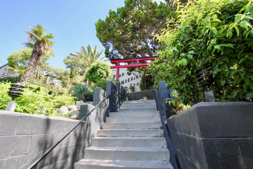 The red entrance seen at the top of the stairs at Park Imperial