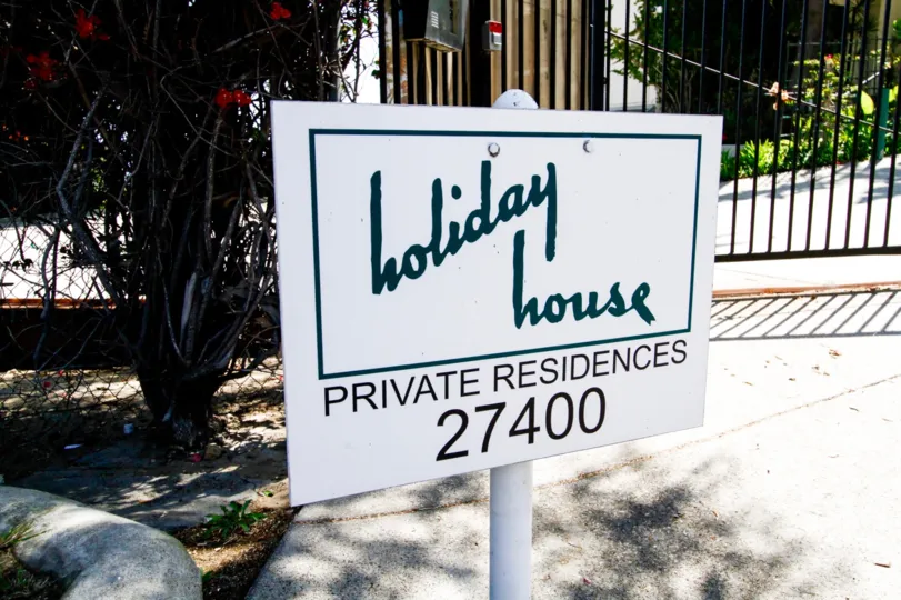 The sign seen at the Holiday House in CA California