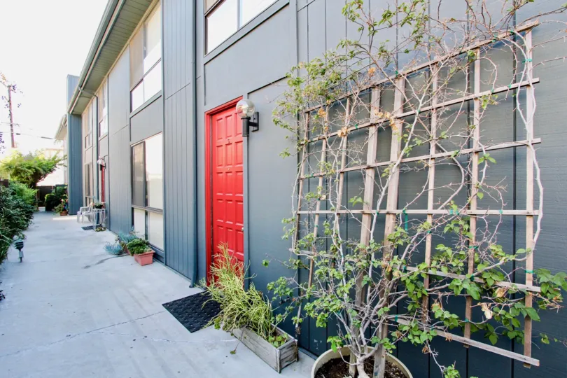 A red door seen at 12772 Pacific Ave