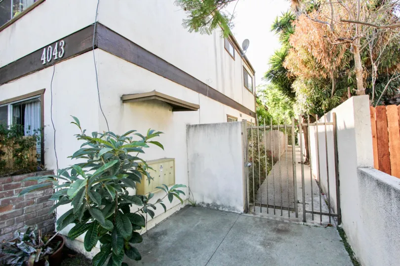 The gate into 4043 Wade St